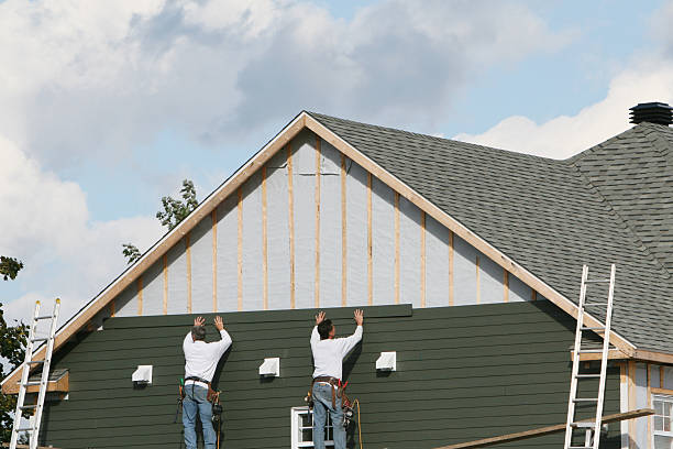 Professional Storm Damage Siding Repair technician working in Acton, MA
